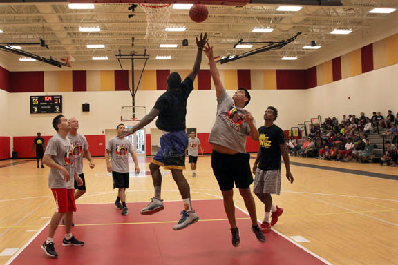 Pemayetv Emahakv Charter School faculty plays against the Court Kingz in an exhibition basketball game Sept. 18 as part of the bullying prevention program at the school.