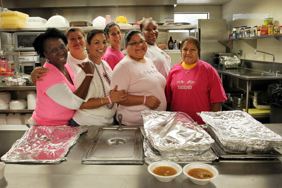 Big Cypress Senior Center employees are pretty in pink outfits as they pose in the kitchen Oct. 23 in honor of Breast Cancer Awareness Month. 