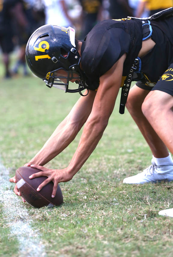 Blevyns Jumper, from the Big Cypress Reservation, practices snapping Nov. 10 at American Heritage School in Plantation. Blevyns is in his second season as Heritage’s long snapper. The Patriots finished the regular season ranked among the top teams in the nation. 