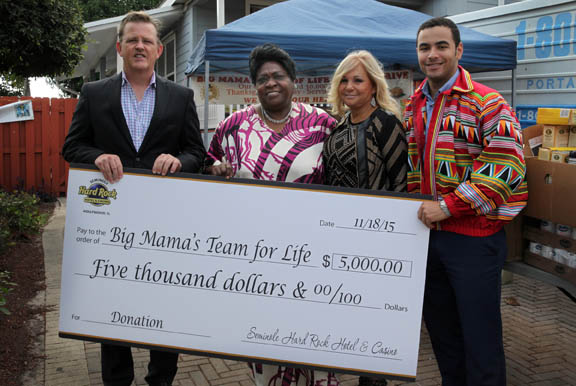 Team of Life charity receives a check from the Seminole Hard Rock Hotel & Casino Hollywood Nov. 18 in Fort Lauderdale. From left are Bill Wright, president of Seminole Hard Rock Hotel & Casino Hollywood; Team of Life’s Essie ‘Big Mama’ Reed; Susan Renneisen, vice president community affairs and special events of Seminole Hard Rock Hotel & Casino; and Luis Acevedo, senior analyst for the Board of Directors.