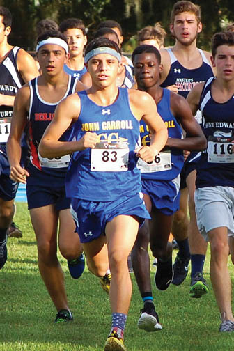 Luke Baxley Jr., John Carroll Catholic High School’s top boys cross country runner this season, leads a pack of runners during a race.   (Photo courtesy of Angel Robinson)