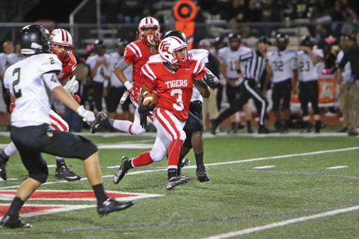 Fort Gibson High School tailback Jesse Sanchez dashes past defenders during a game from the 2015 season in Oklahoma. Jesse, a junior, rushed for more than 600 yards this season. (John Hasler/Hasler Productions/Muskogee, OK)
