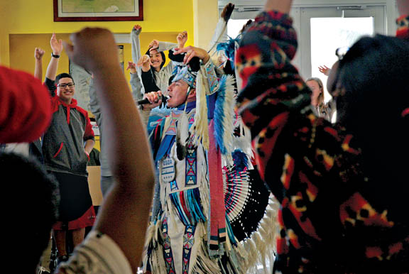 Apsaalooke (Crow) Nation hip-hop artist Supaman rocks a crowd of middle school students Feb. 12 at the Pemayetv Emahakv Charter School cafeteria. Supaman also spoke to students about the importance of making the right choices and staying optimistic.