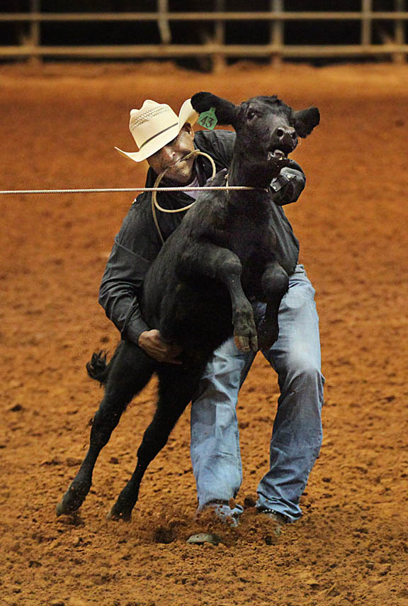 Josh Jumper ties down a calf in a calf roping contest at the first Betty Mae Jumper Memorial Rodeo Feb. 20 at Junior Cypress Rodeo Arena in Big Cypress.