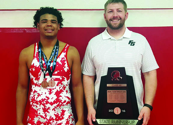 Fort Gibson High School sophomore wrestler Sammy Micco Sanchez and his coach Sammy Johnson pose after the team finished runner-up in the Oklahoma high school state dual tournament Feb. 20. The following week Sammy Micco Sanchez placed at the Class 4A individual state tournament. He finished third.