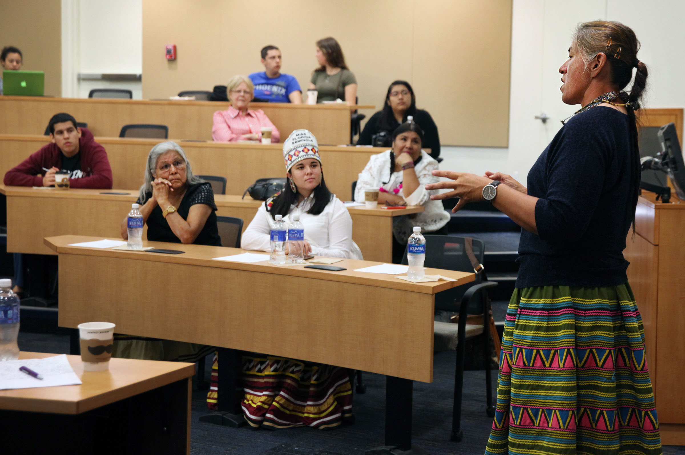 Florida International University students and guests listen March 29 while Miccosukee Tribe citizen Betty Osceola discusses environmental concerns during a Seminole and Miccosukee Women; Culture, Community, Family and Public Life session at the school’s Global Indigenous Forum.
