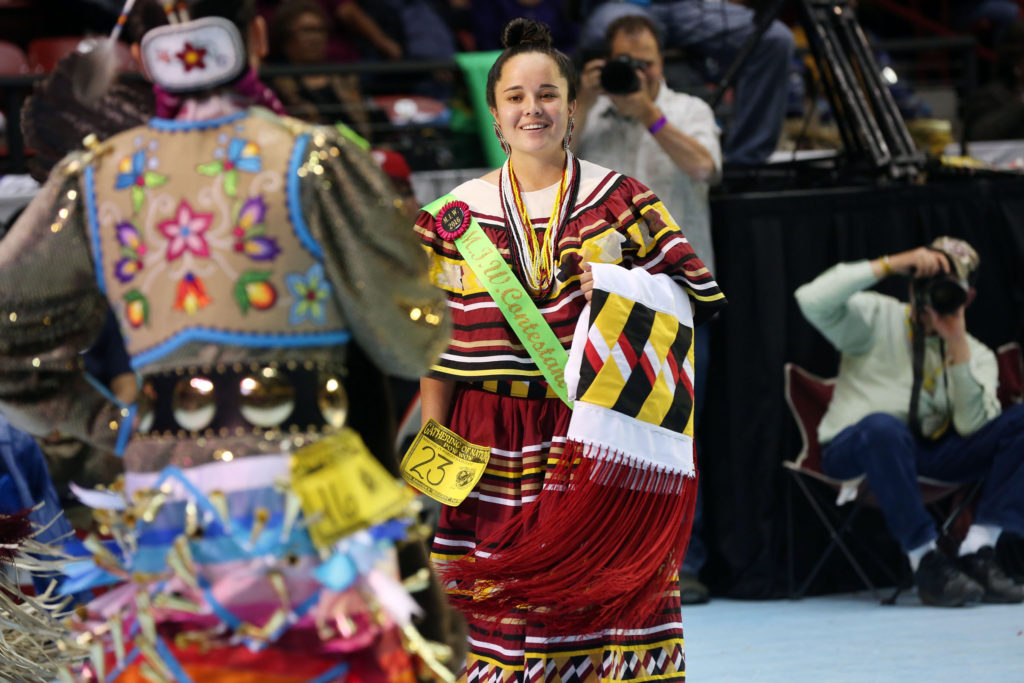 As members of the media photograph the event, Miss Florida Seminole Destiny Nunez competes in the Miss Indian World Pageant dance competition in “The Pit” of the University of New Mexico in Albuquerque April 29.