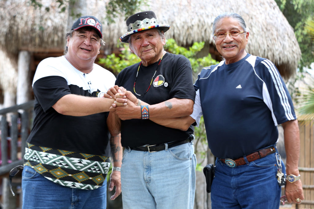 Hollywood Board Rep. Steve Osceola, American Indian Movement co-founder Dennis Banks, and President Mitchell Cypress meet at Billie Swamp Safari in Big Cypress where the Tribe hosted the Longest Walk 5 participants June 4. 