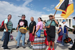 Members of We Do Recover Charlie Tiger, Kenny Tommie, Arnie Gore and Christopher Billie pose for a photo with American Indian Movement founder and leader Dennis Banks of the Longest Walk 5 as they arrive at the Lincoln Memorial in Washington, D.C. on July 15.