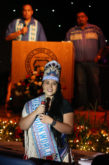 Miss Indian World Danielle Ta’Sheena Finn, served as a judge at the Miss Florida Seminole Pageant July 23 in Hollywood. Emcees Wovoka Tommie and Lewis Gopher are in the background.