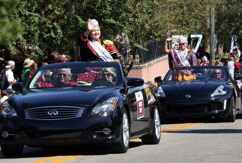 Miss Florida Seminole Kirsten Doney and Jr. Miss Florida Seminole Thomlynn Billie wave to the crowd during FSU’s homecoming parade Oct. 14.