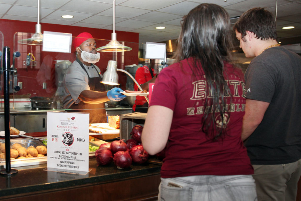 FSU students line up for the special Seminole Pride Beef dinner of carved striploin steak, baked potato bar, creamed spinach and seasoned buttered corn in the Suwannee Room dining hall Oct. 14. (Beverly Bidney photo)