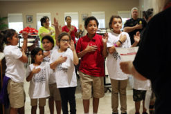 Immokalee youth take the Red Ribbon pledge in the community center prior to kicking off Red Ribbon Week Oct. 17 with a community walk/run through the reservation. (Beverly Bidney photo)