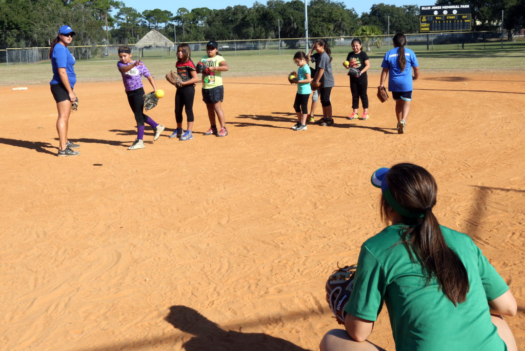 FGCU pitching coach Erika Bennet gives pitching advice to youngsters during a drill at the clinic. (Kevin Johnson photo)