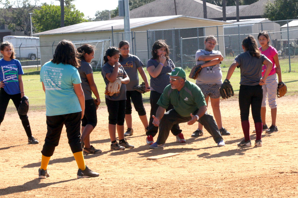 Florida Gulf Coast University softball coach Dave Deiros provides instruction to youngsters during the team’s clinic at Ollie Jones Memorial Park on Dec. 3 in Brighton. (Kevin Johnson photo)