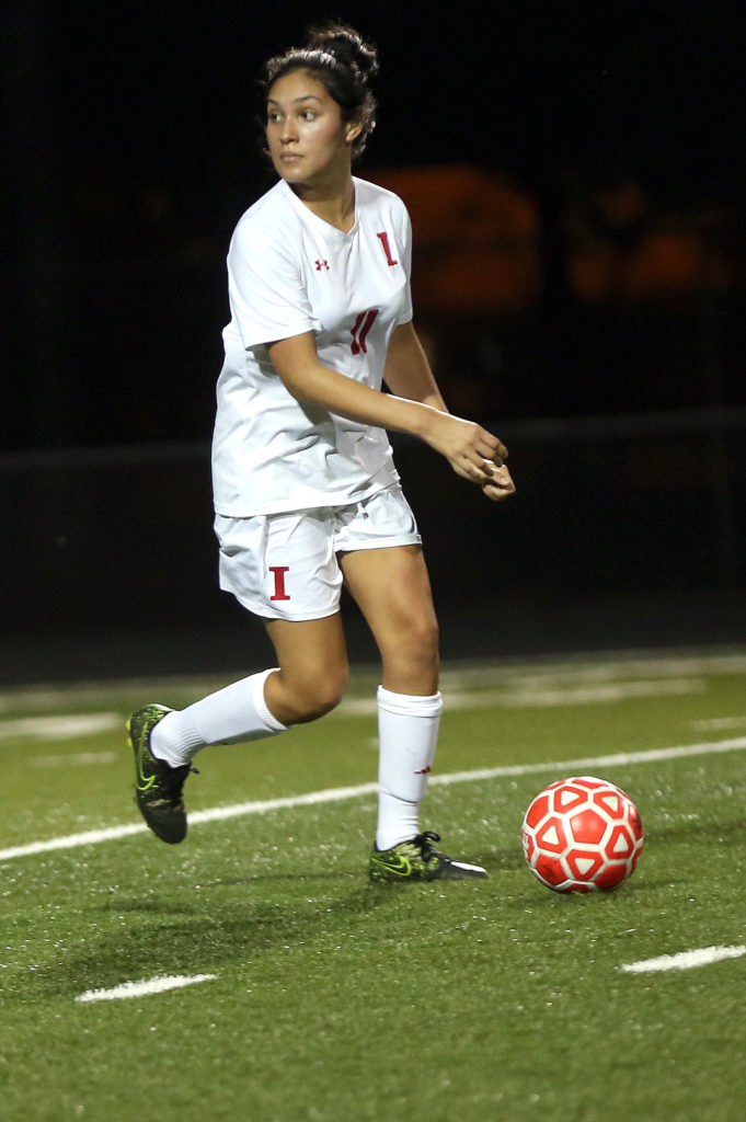 Immokalee High midfielder Jada Holdiness controls the ball against Lely. (Kevin Johnson photo)