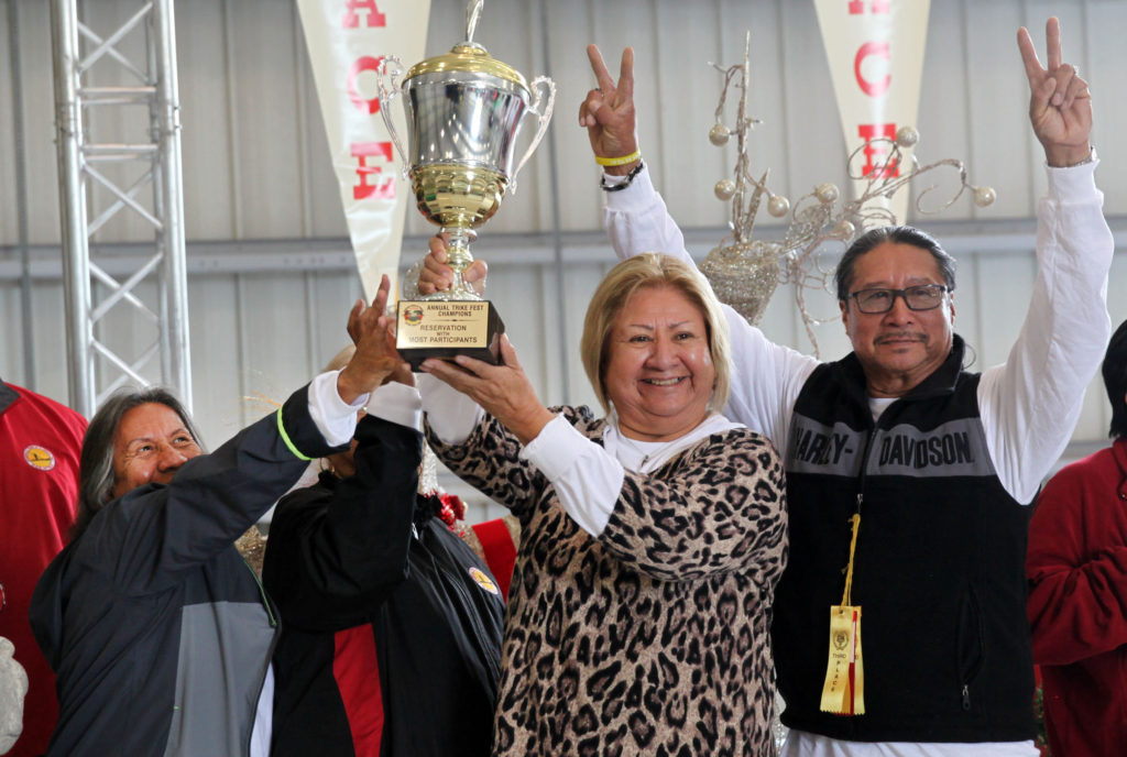 Virginia Tommie, Louise Osceola and Ronnie Billie Sr. have plenty of reasons to celebrate as the Big Cypress team won for most participants and the overall race in the 12th annual Trike Fest on Dec. 9. (Beverly Bidney photo)