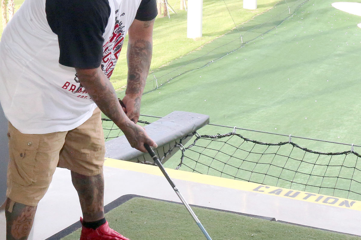Angelo Osceola lines up for a big swing. The event, where the Tribe reserved the third floor of Topgolf for a few hours, was sponsored by the Hollywood Council Office. (Damon Scott photo)
