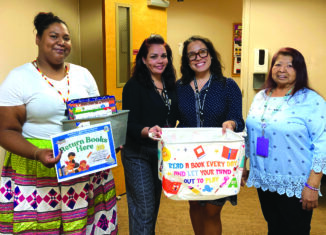 From left to right, Big Cypress education work experience trainee Janessa Jones, CBH administrative assistant Maria Rivera, CBH child clinical associate Gabriella Velasco and library assistant Claudia Doctor with the book bin.