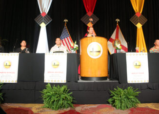 President Holly Tiger speaks at the Board of Directors' annual shareholders meeting March 29 in Hollywood.