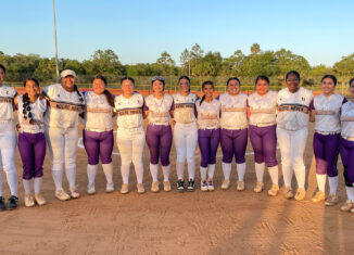 Thirteen Seminoles were part of the Moore Haven versus Okeechobee high school varsity softball game April 14 at Ollie Jones Memorial Park on the Brighton Reservation. From left to right are Charisma Micco, Tehya Nunez, Preslynn Baker, Daliyah Nunez, Teena Maree Covarrubias, Dyani Kayda, Truley Osceola, Melaine Bonilla, Joleyne Nunez, Kiera Snell, Tahnia Billie, Alyssa Madrigal and Adeline Garcia.