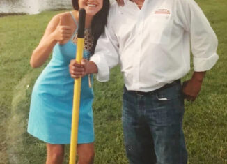 Apolonia Nunez, left, and her father, David Nunez, attend a groundbreaking for a playground in Okeechobee in 2018. Her father is holding a yellow shovel in his right hand.