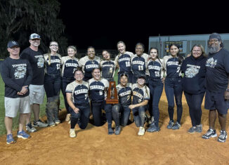 The 2025 Class Rural District 8 softball champions Moore Haven High School. The team poses with the trophy.